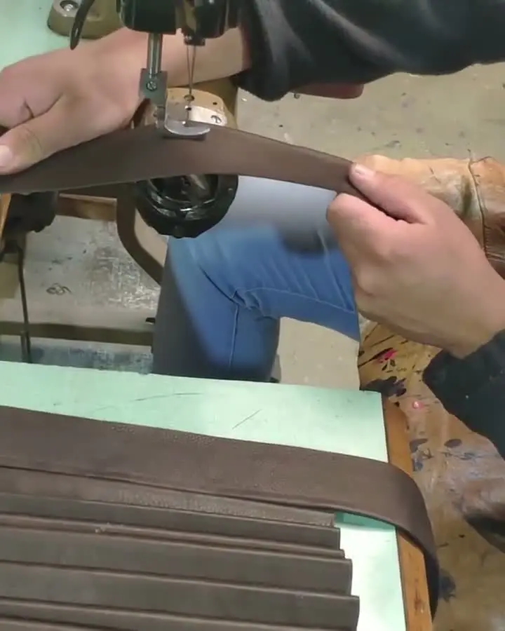 Stitching leather in the workshop